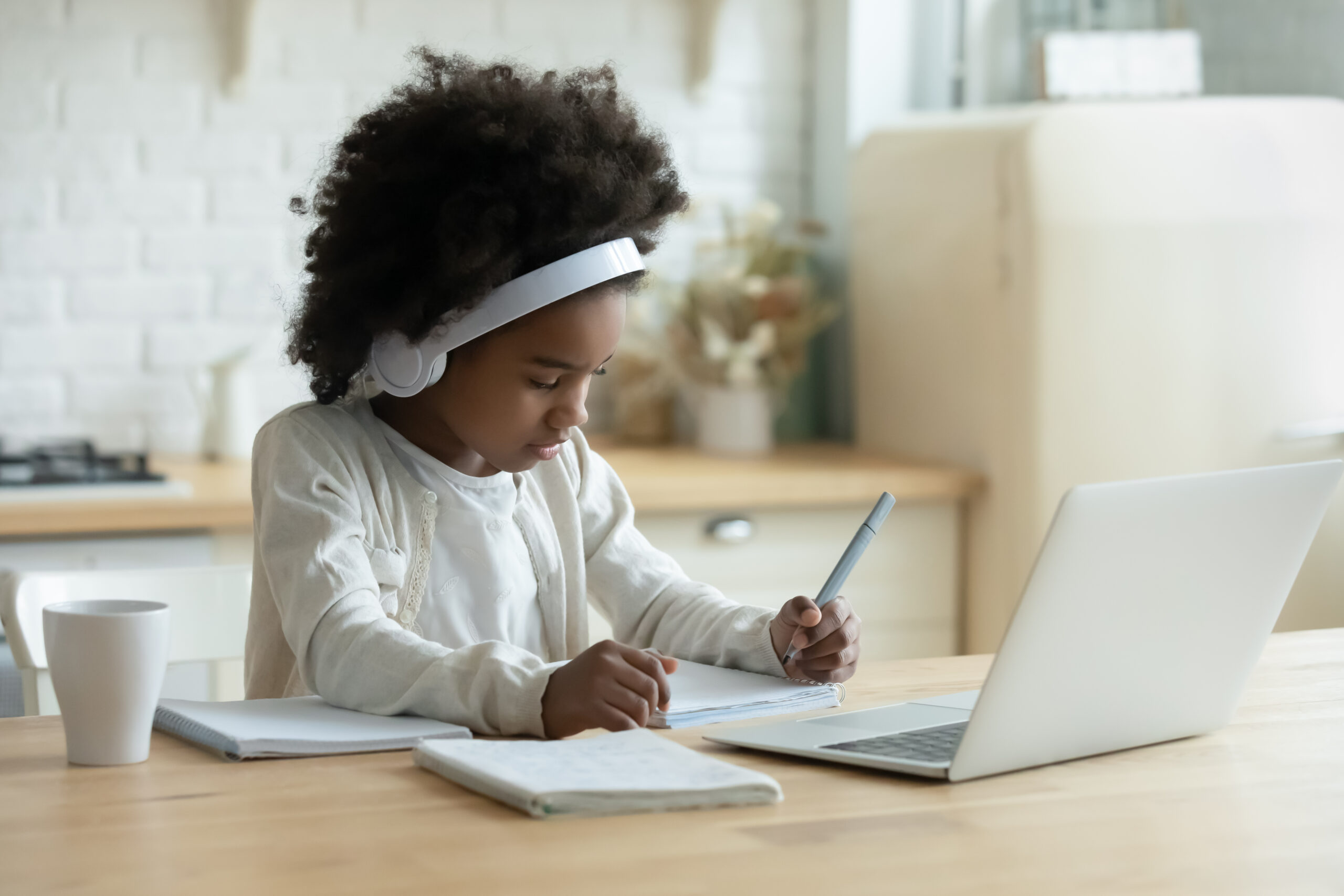 In,Kitchen,Schoolgirl,Do,Homework,,Focused,Little,African,Girl,Wear